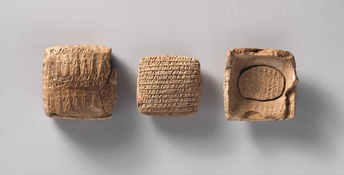 An Old Assyrian clay tablet, its sealed clay case, and the case broken open to reveal the tablet inside